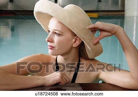 Young woman in a swimming pool at a spa View Large Photo Image Stock Photo - Young woman in a swimming pool at a spa. Fotosearch