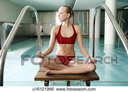 Young woman in a swimming pool at a spa View Large Photo Image Stock Photograph - Young woman in a swimming pool at a spa. Fotosearch