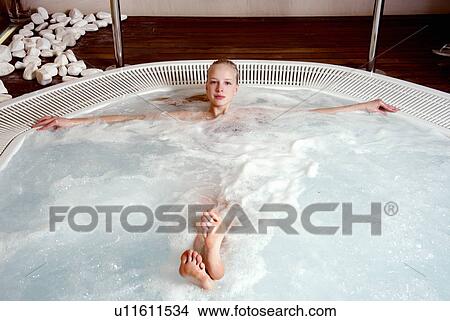 Young woman in jacuzzi at a spa View Large Photo Image Picture - Young woman in jacuzzi at a spa. Fotosearch