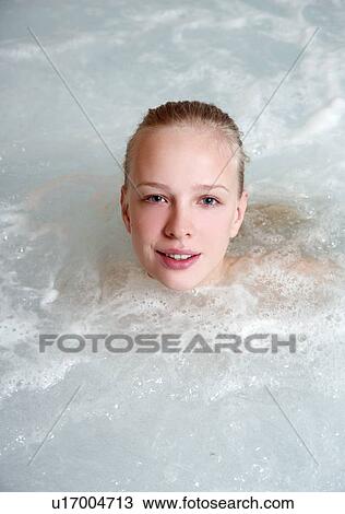 Young woman in jacuzzi at a spa View Large Photo Image Stock Image - Young woman in jacuzzi at a spa. Fotosearch
