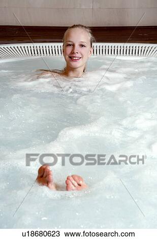 Young woman in jacuzzi at a spa View Large Photo Image Stock Image - Young woman in jacuzzi at a spa. Fotosearch