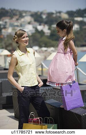 Mother and daughter with shopping bags View Large Photo Image Stock Image - Mother and daughter with shopping bags. Fotosearch