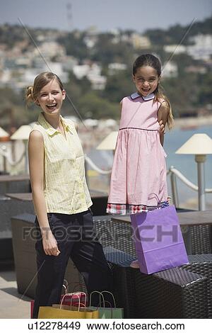 Mother and daughter with shopping bags View Large Photo Image Stock Photo - Mother and daughter with shopping bags. Fotosearch