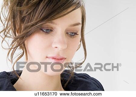 Stock Image - Portrait of young woman. Fotosearch
