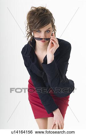 Stock Photograph - Portrait of young woman wearing sunglasses. Fotosearch