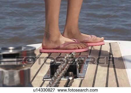 feet wearing flip flops Stock 