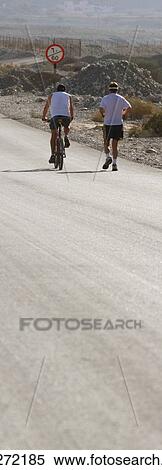 Stock Photography - european, men, walking, desert. Fotosearch