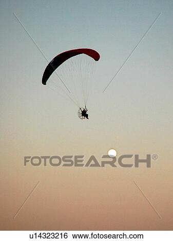 Stock Photograph - moon, paraglide, parashoot, sport, air. Fotosearch