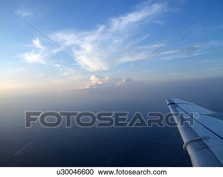 Stock Image - Sky, Aeroplane, Flying, Fly, Flight, Clouds, Airplane. Fotosearch