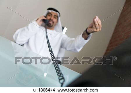Picture - business, businessmen, businessman, Arabic. Fotosearch