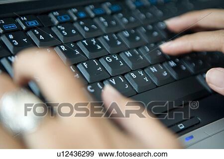 Stock Photo - business, typing, keyboard, Arabic. Fotosearch
