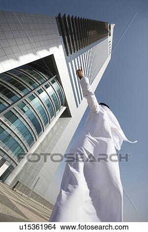 dishdash, businessman, shumagh, tower, business, trade, arabic View Large Photo Image Picture - dishdash, businessman, shumagh, tower, business, trade, arabic. Fotosearch