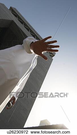 Stock Image - dishdash, businessman, shumagh, tower, business, trade, arabic. Fotosearch