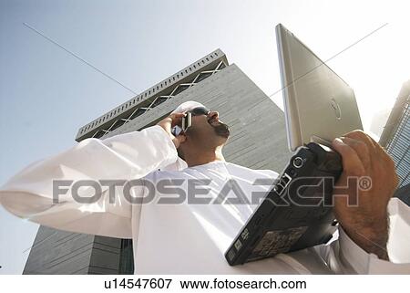 dishdash, businessman, shumagh, tower, business, trade, arabic View Large Photo Image Stock Photo - dishdash, businessman, shumagh, tower, business, trade, arabic. Fotosearch
