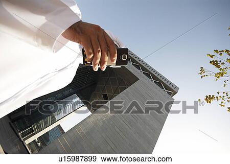 dishdash, businessman, shumagh, tower, business, trade, arabic View Large Photo Image Stock Photo - dishdash, businessman, shumagh, tower, business, trade, arabic. Fotosearch