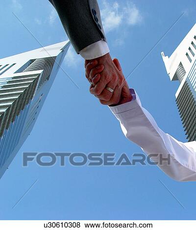 Stock Photo - emirates, business, hands, shake, shaking, tower, arabic. Fotosearch