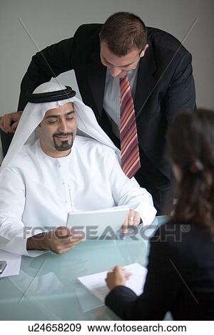 Stock Photo - meeting, business, contract, businessmen, businessman, Arabic. Fotosearch