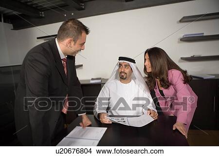 Picture - office, business, meeting, businessmen, businessman, Arabic. Fotosearch