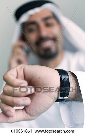Stock Image - time, business, watch, businessmen, businessman, Arabic. Fotosearch
