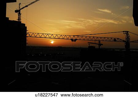 Stock Photo - sunset, sunrise, rise, construction, dubai, building. Fotosearch