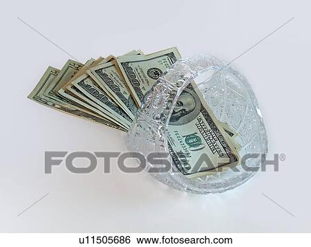 Stock Photograph - business, holding, banking, cash, economy, oil, savings. Fotosearch