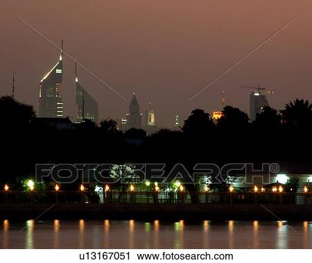 Stock Image - dubai, emirates, towers, water, reflection, evening, night. Fotosearch