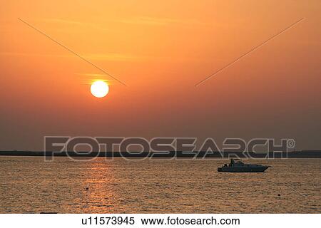 Stock Photography - dubai, sunset, sunrise, boat, yacht, rich, expensive. Fotosearch