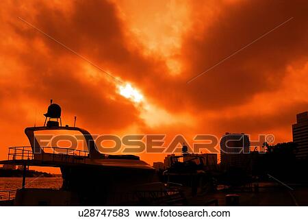 Stock Image - silhouette, dubai, creek, deira, boat, sunrise, sunset. Fotosearch
