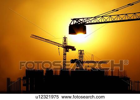 Stock Photography - sunset, sunrise, rise, dubai, construction, buiding, work. Fotosearch