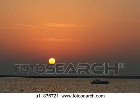 Stock Image - dubai, sunset, sunrise, boat, yacht, rich, expensive. Fotosearch