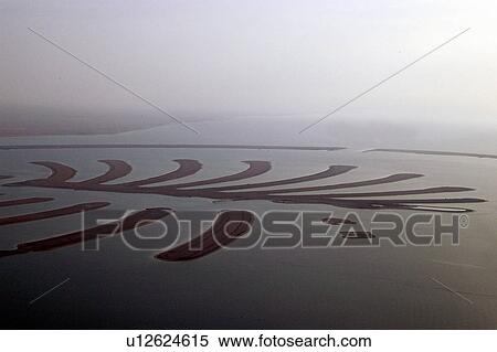 Stock Photography - dubai, aerial, dubai, palm, jebel, construction. Fotosearch