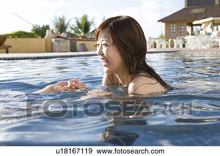 Couple holding hands in swimming pool, Saipan View Large Photo Image Stock Photo - Couple holding hands in swimming pool, Saipan. Fotosearch