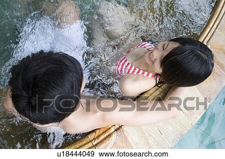 Stock Photo - Couple in a Jacuzzi, Saipan. Fotosearch