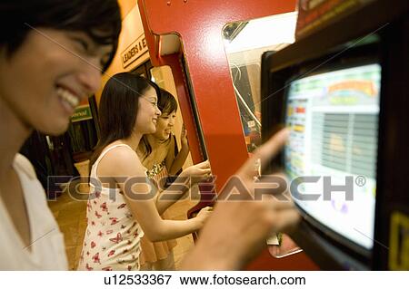 Stock Photo - Friends playing game, Saipan. Fotosearch