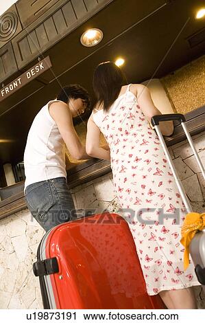 Young couple at the front desk, Saipan View Large Photo Image Stock Image - Young couple at the front desk, Saipan. Fotosearch