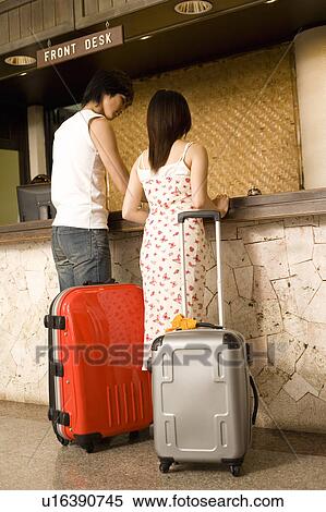 Young couple at the front desk, Saipan View Large Photo Image Stock Photography - Young couple at the front desk, Saipan. Fotosearch