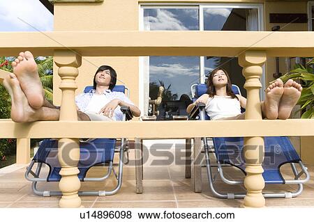Young couple relaxing at balcony, Saipan View Large Photo Image Stock Photo - Young couple relaxing at balcony, Saipan. Fotosearch