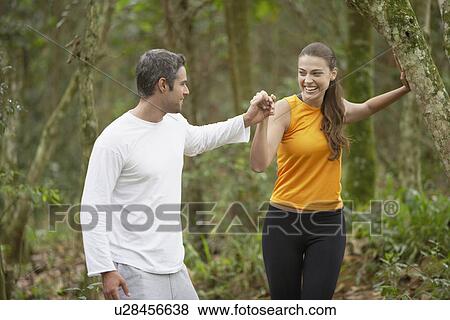 Couple jogging in forest View Large Photo Image Stock Photo - Couple jogging in forest. Fotosearch