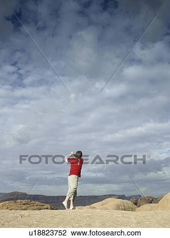 Man playing golf at rock strata View Large Photo Image Stock Image - Man playing golf at rock strata. Fotosearch