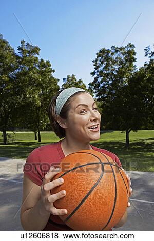Mid Adult Woman Holding Basket Ball View Large Photo Image Stock Photo - Mid Adult Woman Holding Basket Ball. Fotosearch