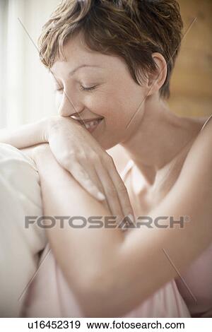 Woman in pajama smiling View Large Photo Image Stock Photo - Woman in pajama smiling. Fotosearch