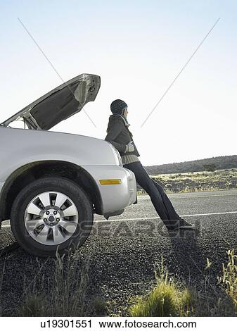Woman with broken car on rural road View Large Photo Image Stock Image - Woman with broken car on rural road. Fotosearch