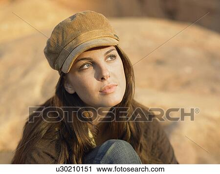 Young woman wearing hat, portrait View Large Photo Image Stock Image - Young woman wearing hat, portrait. Fotosearch