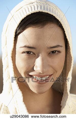 Young woman wearing hood (portrait) View Large Photo Image Stock Photograph - Young woman wearing hood (portrait). Fotosearch