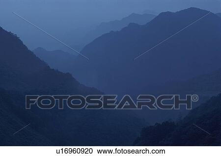 Stock Image - Mountains In Mist. Fotosearch