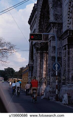 Stock Photograph - People Cycling Down Street. Fotosearch