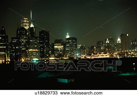 Stock Image - Skyscrapers At Night. Fotosearch