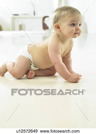 Baby crawling on floor View Large Photo Image Stock Photo - Baby crawling on floor. Fotosearch