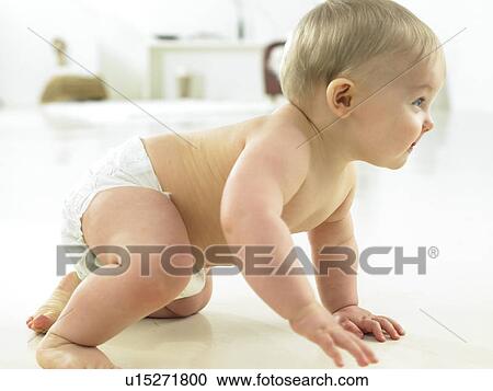 Baby getting up off floor to stand View Large Photo Image Stock Image - Baby getting up off floor to stand. Fotosearch