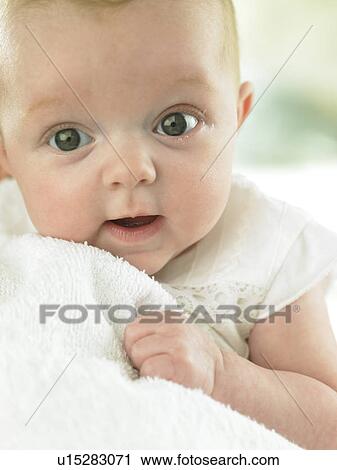 baby holding towel